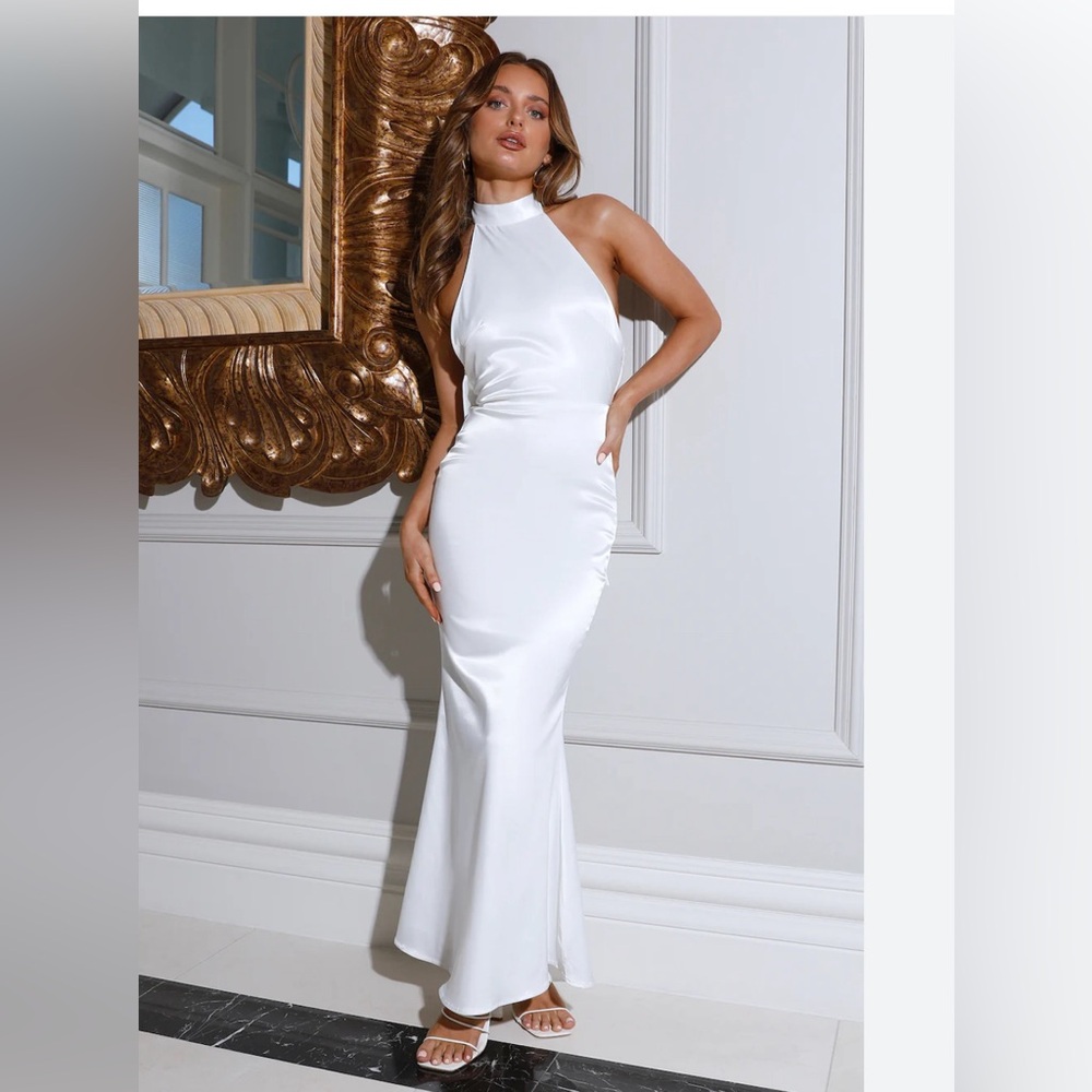 Elegant white gown with high neck and open back